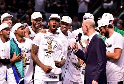 Tim Duncan and the Spurs celebrate Kawhi Leonard's Finals MVP award.